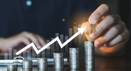 People hand pointing coin stack and the Business Growth graph in concept of  Finance Banking and Economic Growth.