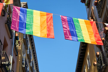 lgbt flags hanging over the street of the city center. Chueca, the epicenter of gay pride in Madrid