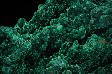 Malachite. green macro detail texture background. close-up raw rough unpolished semi-precious gemstone