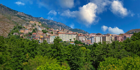 Fototapeta premium View of the town of Corte in the heart of Corsica. Corte is located in inland of Corsica surrounded by green forests and the cliffs of Restonica mountains, Corsica island, France