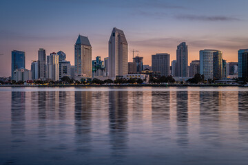 Fototapeta na wymiar Sunrise and the San Diego skyline from Coronado Island