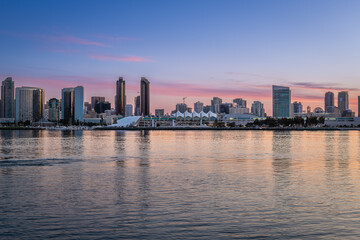 Fototapeta na wymiar Sunrise and the San Diego skyline from Coronado Island