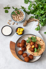 Falafel balls on a wooden cutting board .Vegetarian food.