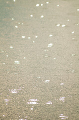 Water background. raindrops on the surface of the water