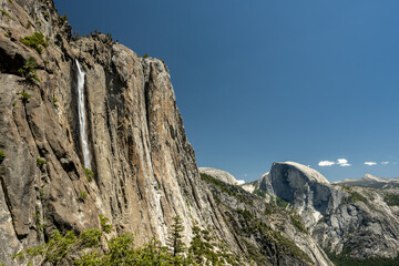 Upper Yosemite Falls With Half Dome In The Distance