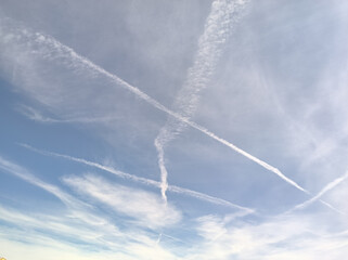 Landscape in the morning of strange clouds forming an X in the sky