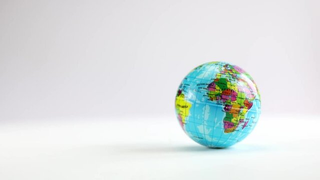 Seamless loop animation of rotating realistic planet Earth with clouds isolated on a white background. Endless animation of Earth globe. Motion graphic, all the countries in the world copy space