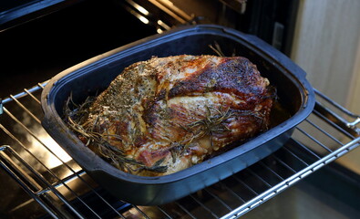 Fried meat on a baking sheet in the oven