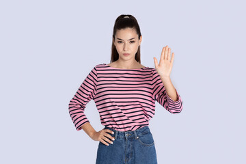 Determined young hispanic woman showing outstretched hand