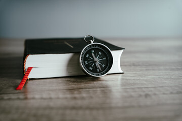 Book and compass on the table © Daniel