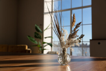 Bouquet of dried flowers against background of window