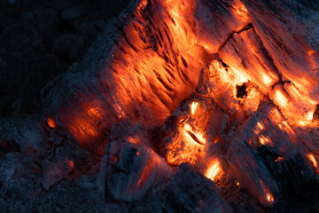 Wood fire. Burning embers with bright color. Wood fire with hot embers and ashes. Background...