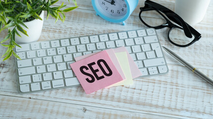 Seo-Optimization Scheme With Words Over White Office Desk Background With Computer Keyboard.