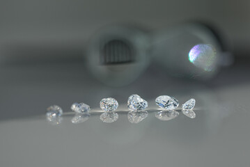 The process of appraisal of diamonds at the workplace of buyer during the action. High quality photo