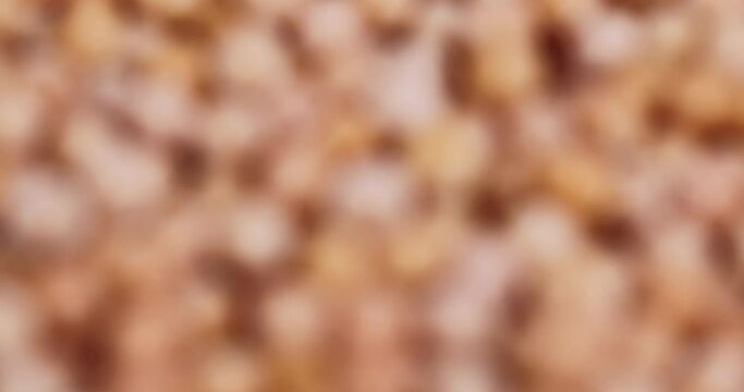 slowly changing abstract orange background, abstract background from unfocused video shooting of orange objects