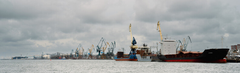 Fototapeta na wymiar Panoramic shot of ships being in maintenance in port Of Klaipeda. 