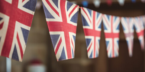 String of union jack bunting flag decorations for a celebration in the United Kingdom. Generative ai