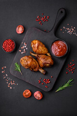 Delicious grilled chicken legs with spices and herbs in teriyaki sauce