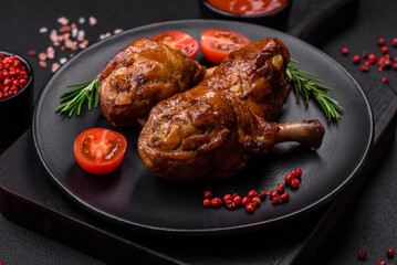 Delicious grilled chicken legs with spices and herbs in teriyaki sauce
