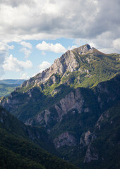 Fototapeta na wymiar top of green mountain with rocks