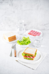 Sandwich with sausage, cheese and tomato for lunch