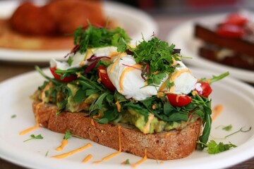 Avocado toast and other breakfast in backgroundt
