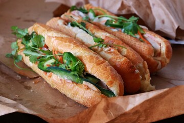 Traditional Vietnamese sandwiches (banh mi) served on parchment paper