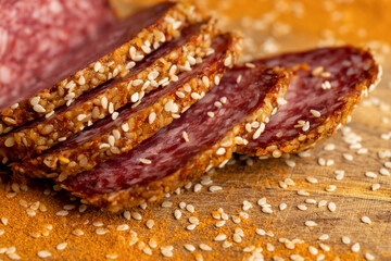 Sliced pork and beef sausage with spices and lots of sesame seeds
