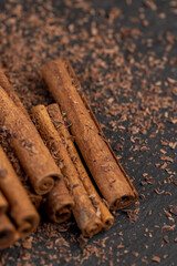 solid aromatic cinnamon on the table in chocolate