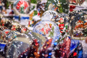 Festive cityscape - view of the Christmas decorations with Christmas crystal ball closeup on the Christmas Market (Weihnachtsmarkt) in the city of Vienna, Austria