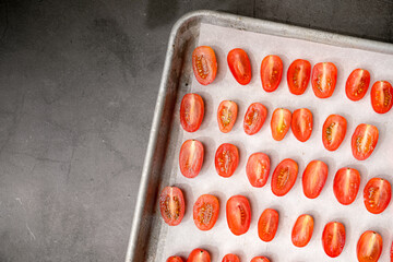 Cut tomatoes in the tray. healthy eating and cooking concept.