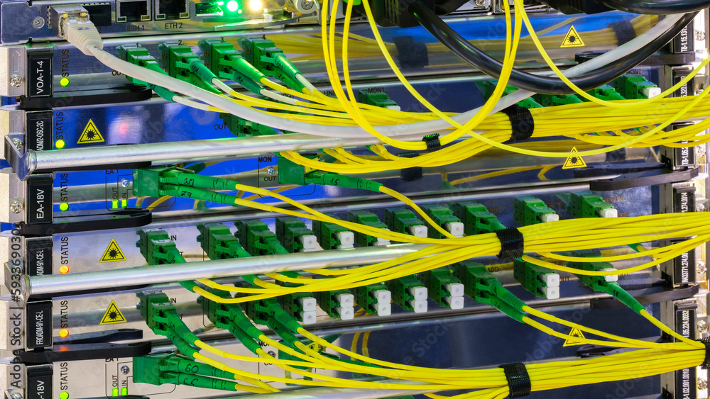 Poster multi colored network cables connected to switch, network technology concept