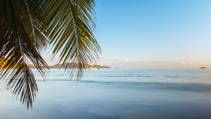Fototapeta premium Nature landscape view of beautiful tropical beach and sea in sunny day. Beach sea space area
