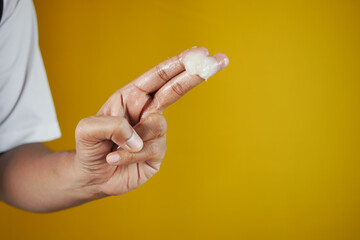 Close up of man hand using petroleum jelly