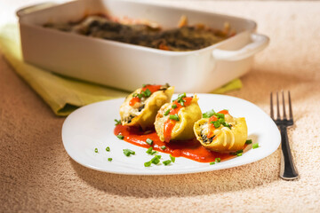 shell-shaped pasta stuffed with spinach and cheese