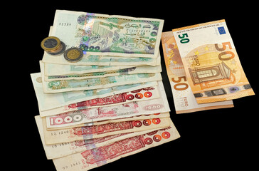 Two fifty Euros bill, six bills of one thousand and five bills of two thousand Algerian dinars with...