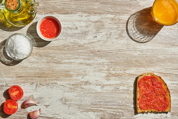 image from above of toast with tomato and its ingredients scattered around the edge of the image