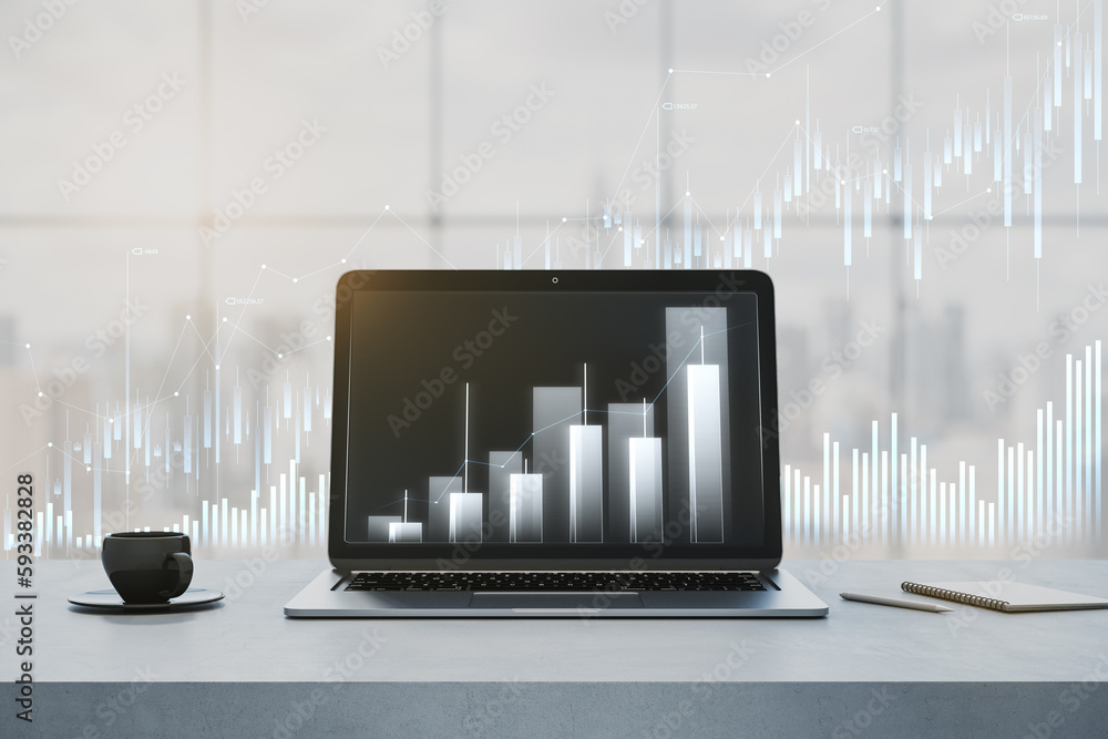 Poster close up of laptop and coffee cup on desktop with glowing business chart hologram on blurry window w