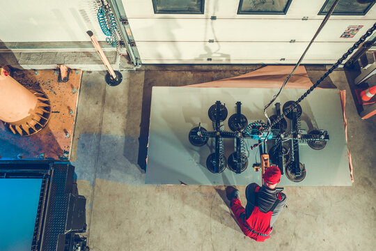 Commercial Vacuum Lifting Machine Operator at Work