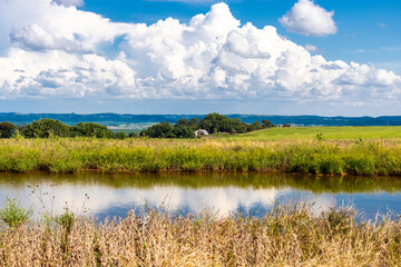 Landscape with a view of the dam and a rural property, located in Brazil
