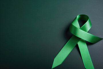 Green ribbon for gallbladder and bile duct cancer awareness month in February, bipolar disorder, mental health illness, kelly green bow. Generative AI