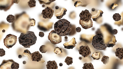 Organic peppercorn, whole and sliced, flying on white background. Floating dried black pepper. Spicy additive ingredient. Creative spices modern food concept. Flying set of spices. Modern pattern