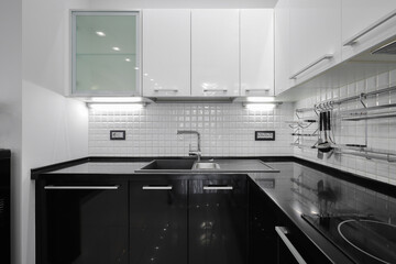 Black and white kitchen furniture front view