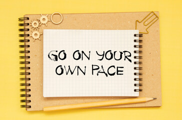 Retro effect and toned image of a woman hand writing a note with a fountain pen on a notebook.