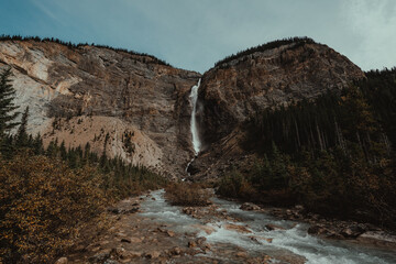 A large waterfall descends the mountain