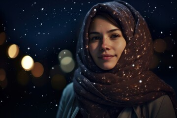 Portrait of young beautiful woman in scarf on the background of night city