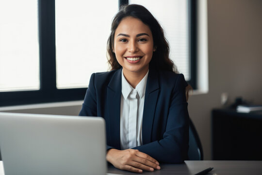 Portrait of a friendly and approachable loan officer with a big smile and a laptop on her desk, ready to provide financial advice, generative ai
