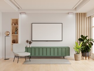 TV on green cabinet have white plaster wall in living room with armchair,minimal design.