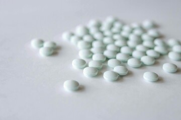 Images of blue-white pills and supplements