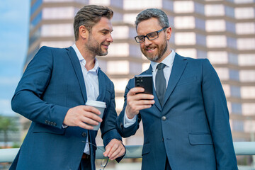 Offering deal, discussing new project. Business man talking on outdoor meeting. Devising big plans with the boss. Business partners are discussing something, teamwork and chatting outdoor.